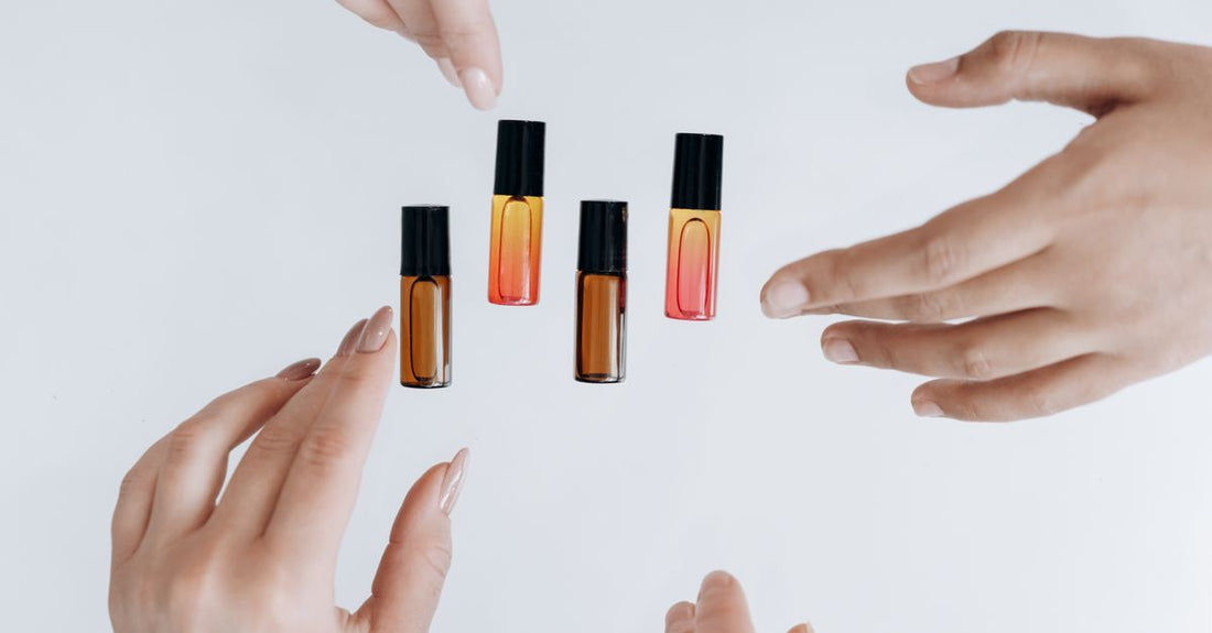 A flatlay of best cuticle oils 2026 bottles with droppers and rollerballs on a neutral background.