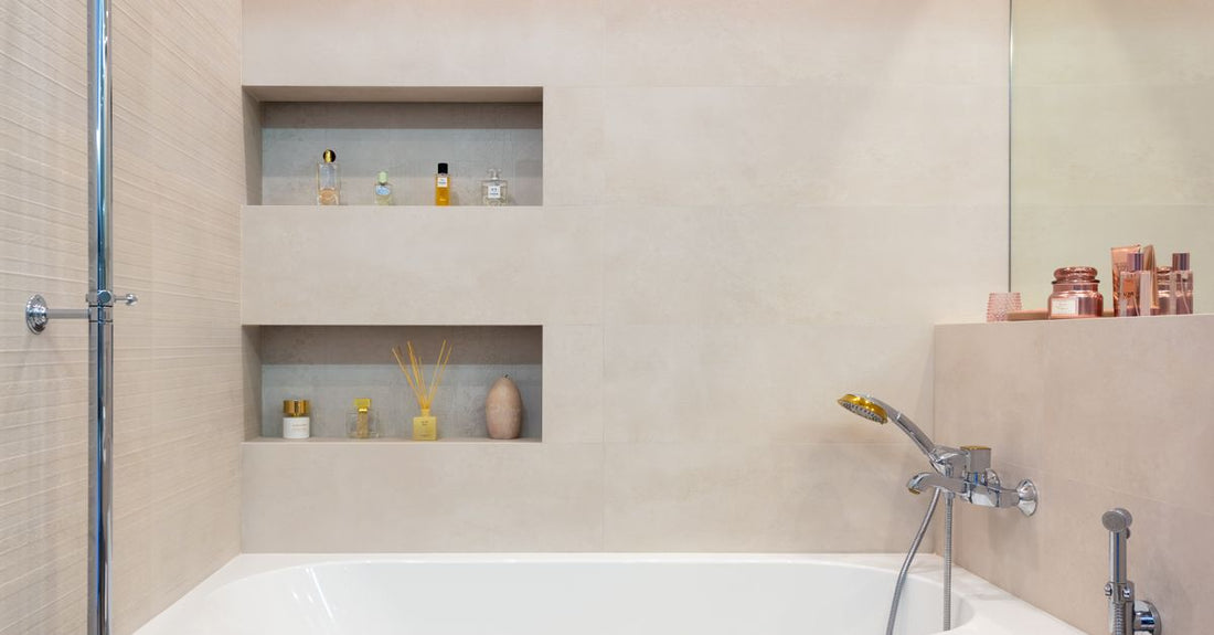 Three antiperspirant deodorant sticks on a bathroom shelf, representing the best antiperspirant deodorant 2026 choices tested by Avelisse.