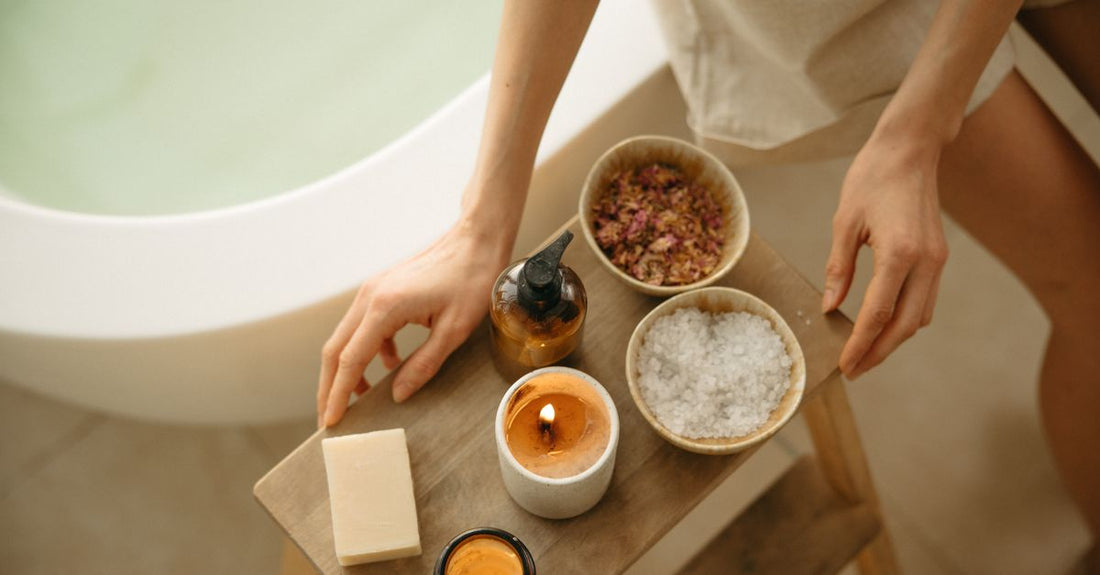 Assorted bath salts in glass jars on a shelf, illustrating how to choose bath salts for different needs