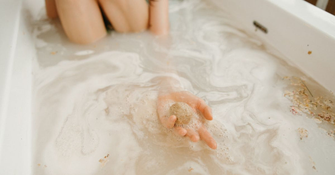 A colourful selection of handmade bath bombs arranged on a marble surface, illustrating a bath bombs buying guide.