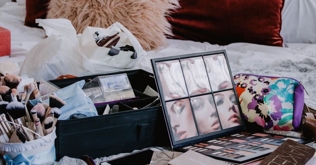 A neatly organised makeup bag with brushes, palettes, and skincare minis, showing how to organise makeup in a bag effectively.