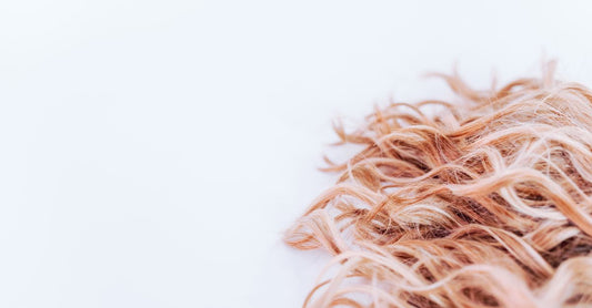 Flatlay of various best hair extensions for thin hair UK, including clip-in and halo types, on a neutral background.
