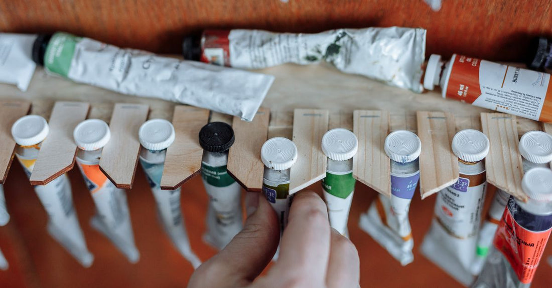 A selection of the best adhesives 2026 arranged on a clean surface, showing different bottle types and applicators.