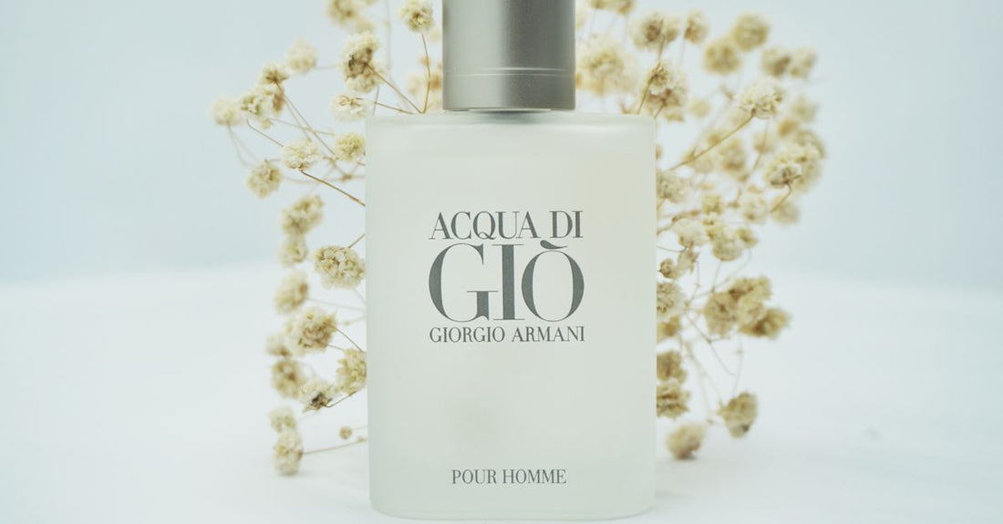 A selection of cologne bottles on a marble surface, illustrating how to choose cologne for different budgets.