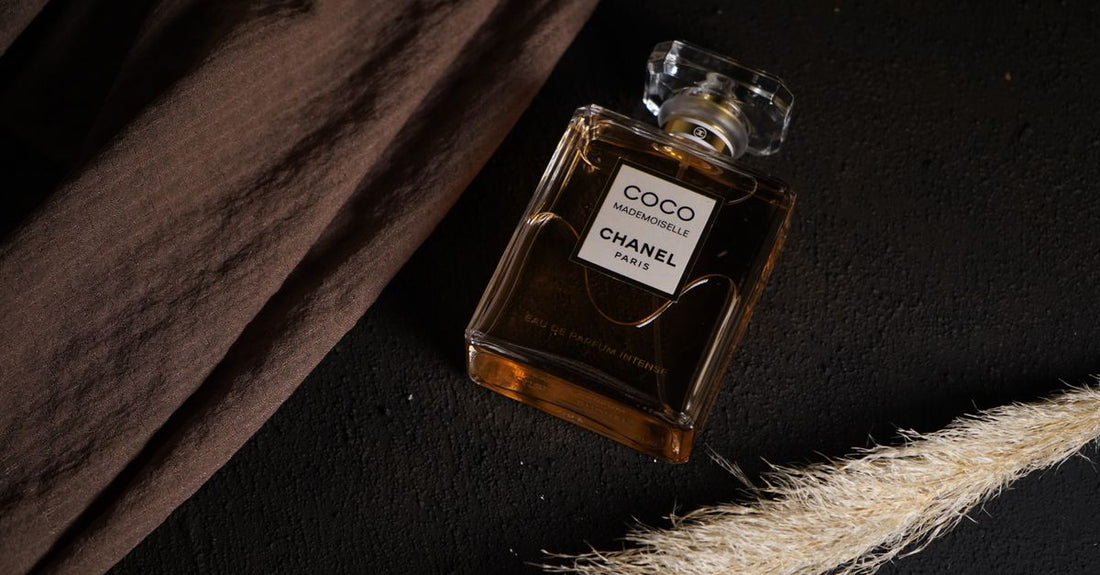 A row of classic cologne bottles on a shelf, illustrating how to choose cologne that lasts