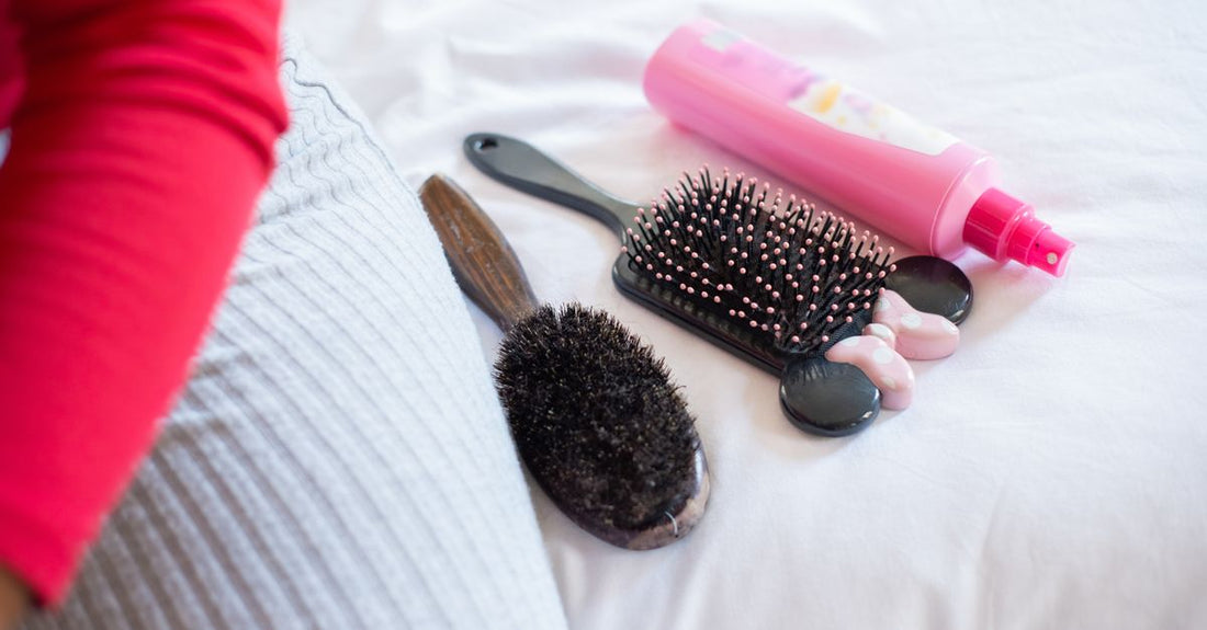 Close-up of a high-quality hairbrush with mixed bristles, demonstrating the best hairbrush for thick hair UK features against a neutral background.