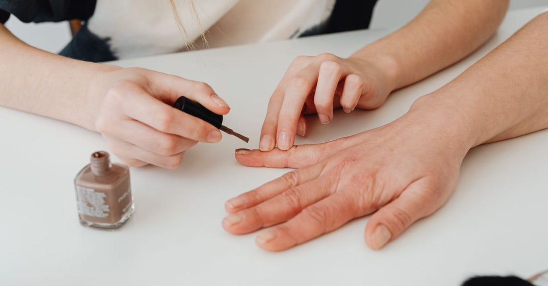 Bottle of the best base coat UK 2026 nail polish on a clean white surface, showcasing its professional formula.