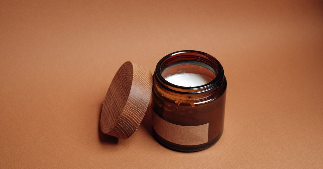 A close-up of a jar of root lifting powder on a white background, demonstrating the fine, matte powder texture used in how to choose root lifting powders UK.