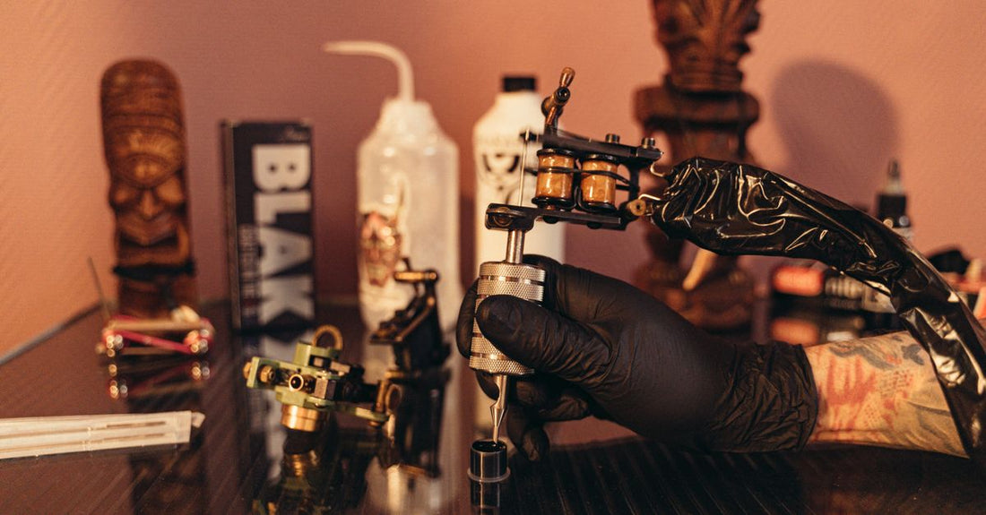 A selection of colourful tattoo ink bottles arranged on a clean white surface, illustrating a tattoo inks buying guide UK.