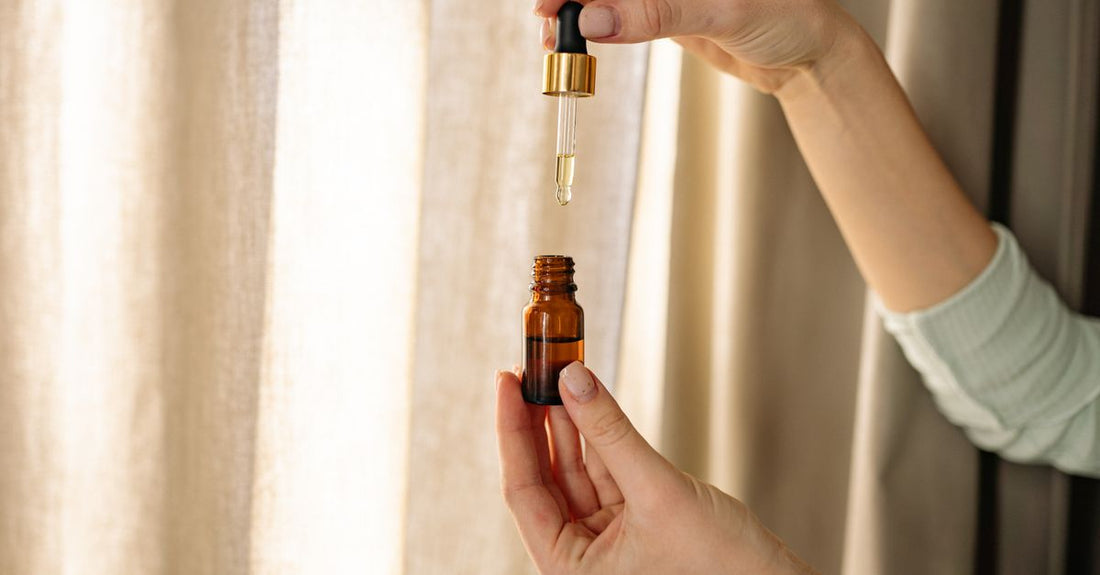 Best hair oil for growth UK displayed in a glass dropper bottle on a light background, representing natural haircare solutions.