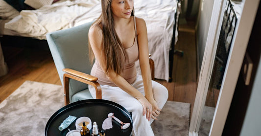Maternity buying guide skincare products arranged flatlay including belly butter and stretch mark oil.