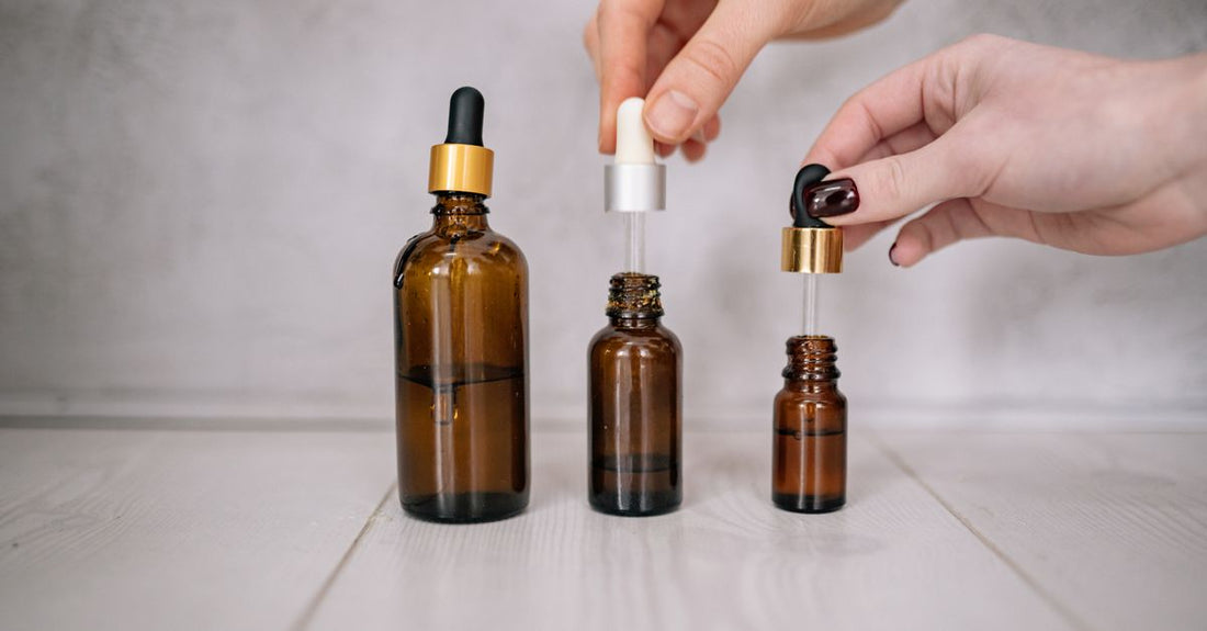 A flatlay of skincare products including cleanser, serum and moisturiser, illustrating how to layer skincare products correctly.
