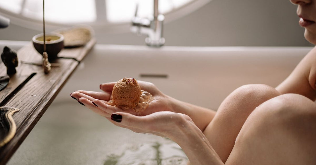 Assortment of best bath bombs 2026 in pastel colours on a marble surface, including moisturising and aromatherapy varieties