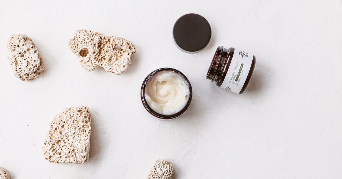 A jar of neck cream on a clean flat surface, illustrating how to use neck cream properly in a skincare routine.