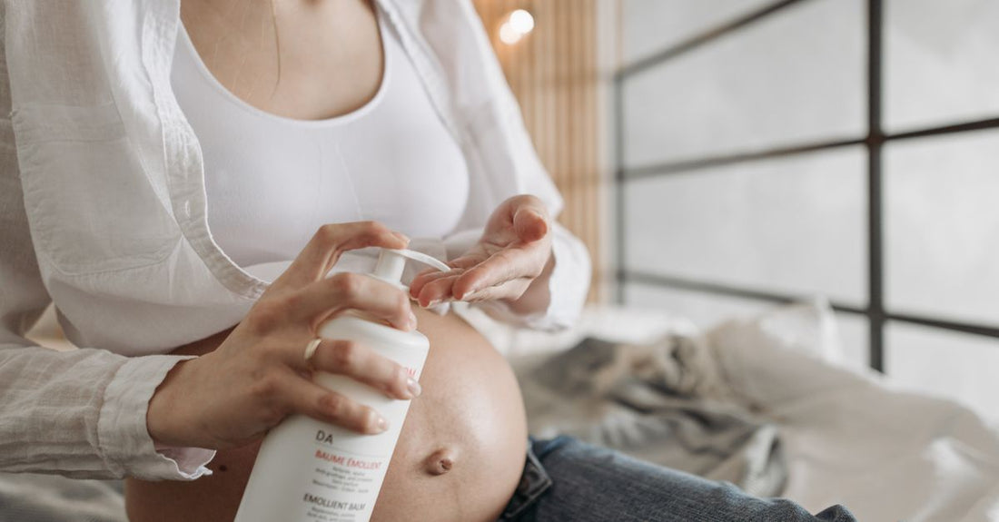 A glass bottle of moisturising body lotion on a marble surface, illustrating a lotions buying guide for long-lasting hydration.