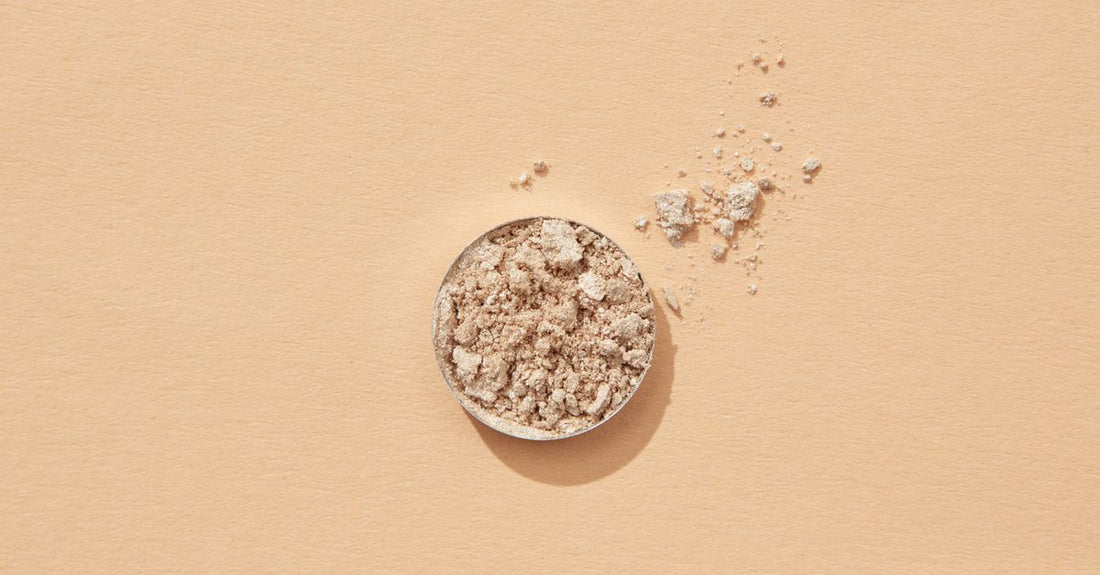 Best bronzers 2026: three pressed bronzer compacts in warm, neutral, and cool undertones on a white marble background