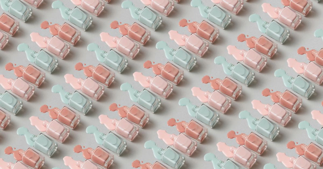 Gel polish buying guide UK with gel polish bottles arranged on a flat surface alongside a UV nail lamp and nail art tools.