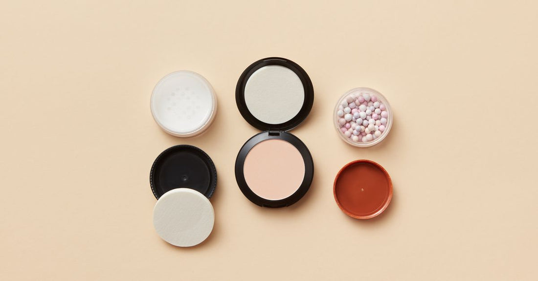 Best powder UK 2026 compact flatlay on marble surface with brush