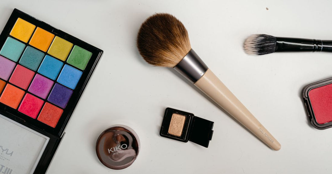 A translucent setting powder jar with a soft puff on a clean white surface, demonstrating how to use setting powder for matte finish.