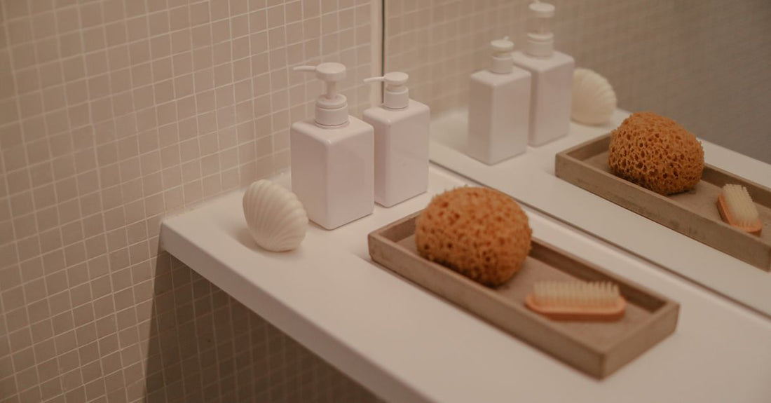 A bottle of hair building fibers on a bathroom shelf, demonstrating how to use hair building fibers for thinning hair.