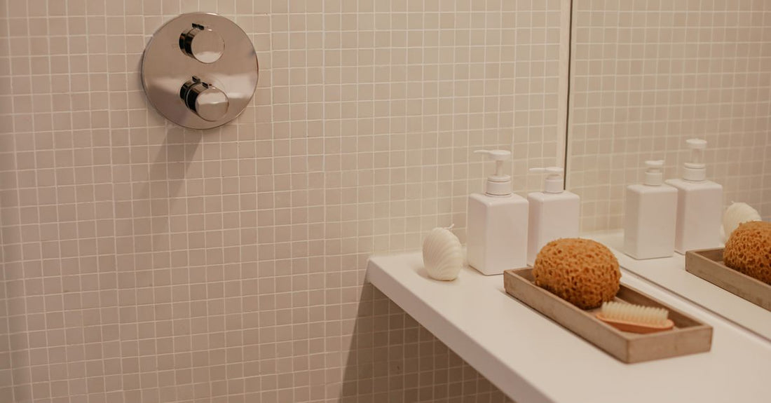 A natural loofah sponge resting on a clean bathroom shelf, demonstrating how to use loofah properly in a modern UK bathroom