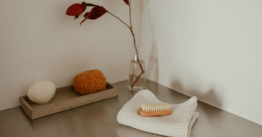 A white-handled nail cleaning brush with dense bristles on a clean surface, representing the best nail cleaning brushes 2026.