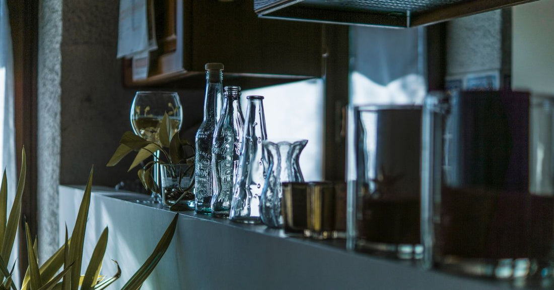 A selection of conditioner bottles on a bathroom shelf, illustrating how to choose conditioners UK for different hair types.