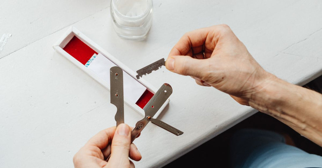 A row of fresh men's razor blade cartridges on a clean surface, representing the best cartridges 2026 for a smooth, long-lasting shave.