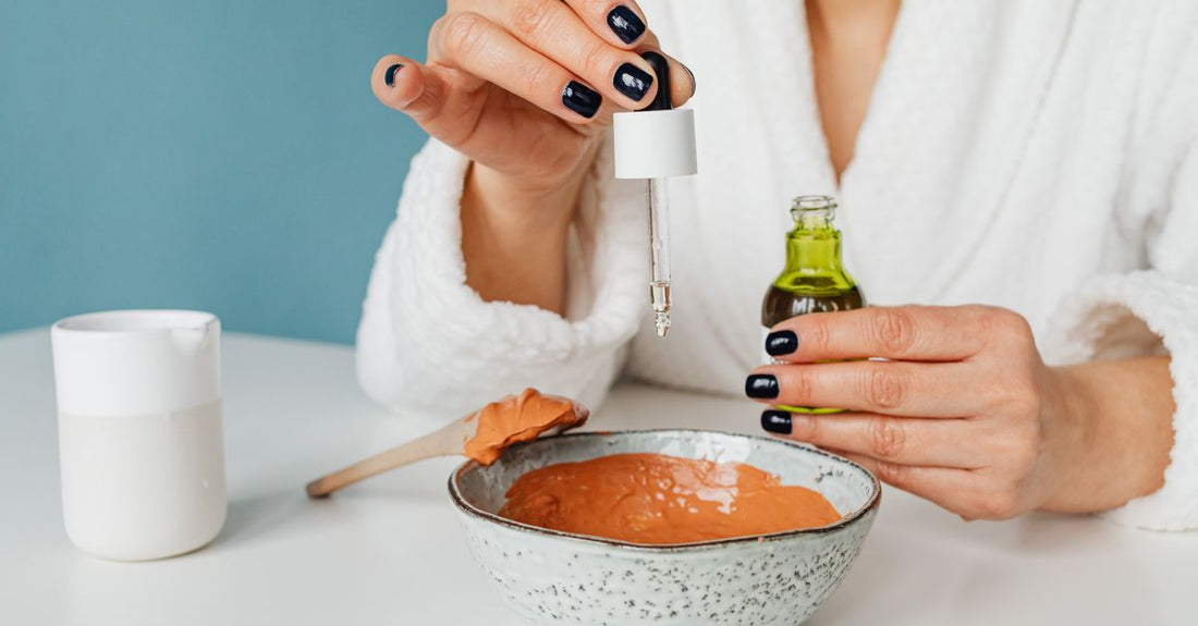 An array of face moisturiser jars and ingredients on a light marble surface, illustrating how to choose face moisturisers for different skin types.