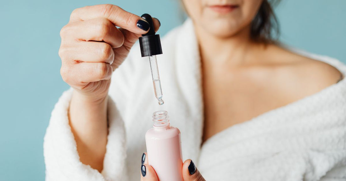 A sleek bottle of avelisse eyebrow growth serum on a marble surface, representing a budget-friendly brow care routine in the United Kingdom.