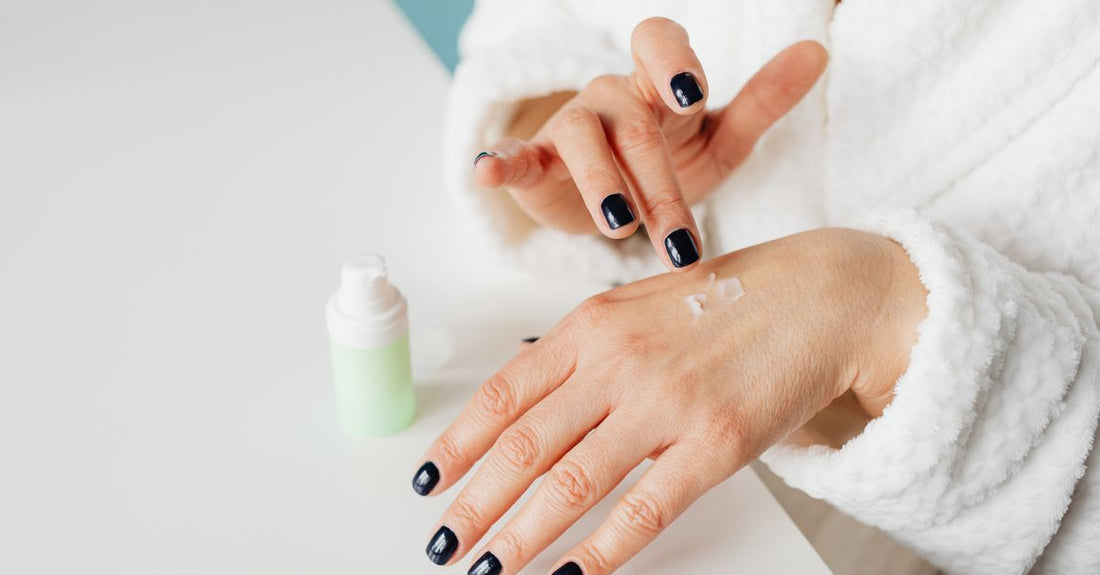 A selection of moisturising creams and serums arranged on a light marble surface, representing a creams buying guide for UK shoppers.