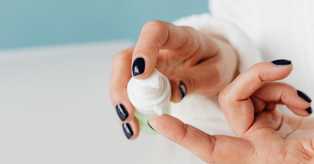 A selection of moisturiser jars arranged on a light marble surface, illustrating a creams buying guide comparison.