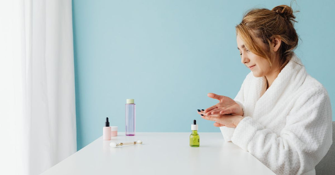 A flatlay of science-backed face skincare products including cleansers, serums and moisturisers on a marble surface, illustrating a face buying guide for UK shoppers.