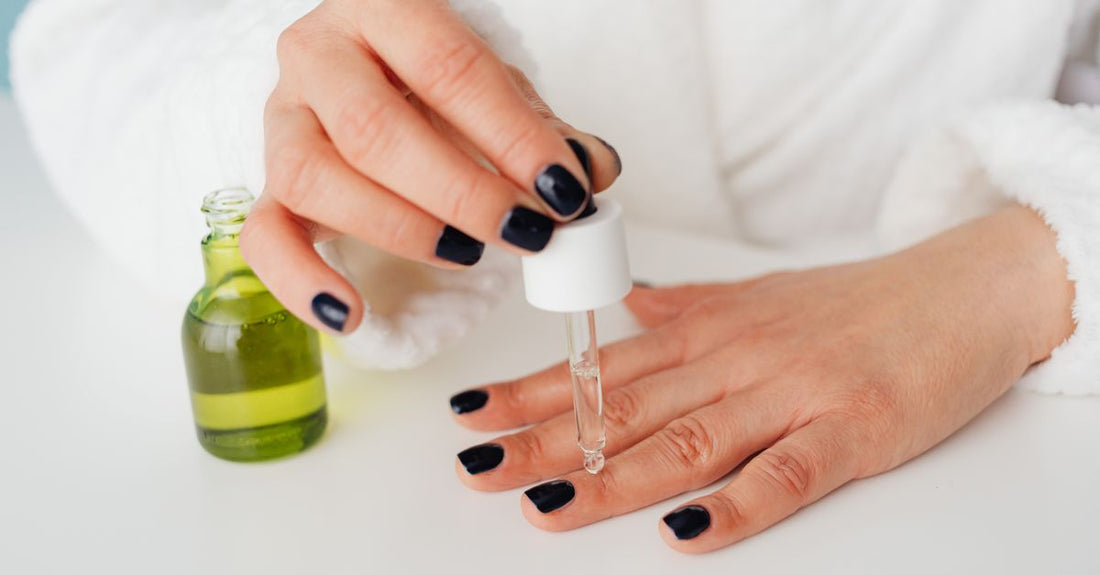Selection of nail base coat bottles displayed on a white surface, illustrating how to choose base coat for a durable manicure.