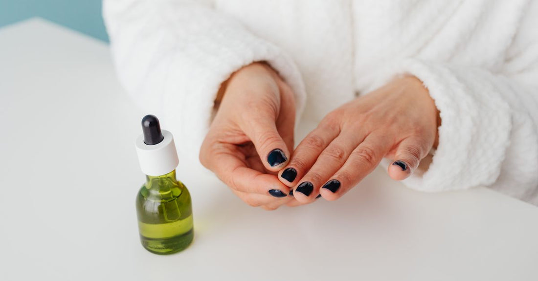 A selection of professional nail base coat bottles on a clean white background, illustrating a base coat buying guide.