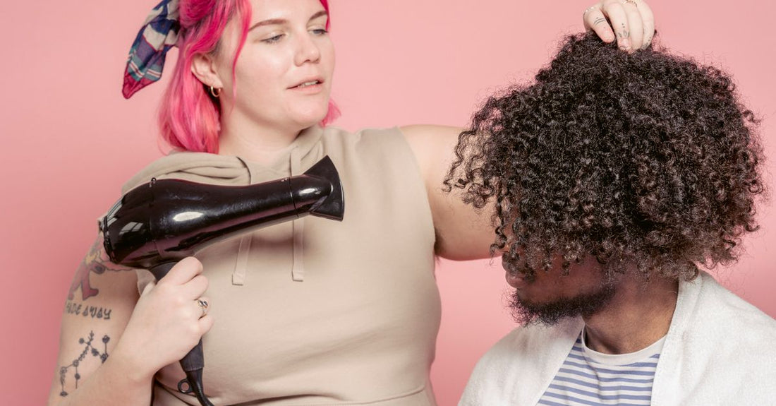 Satin hair dryer bonnet attachment and a handheld blow dryer on a white background, representing the best drying hoods 2026