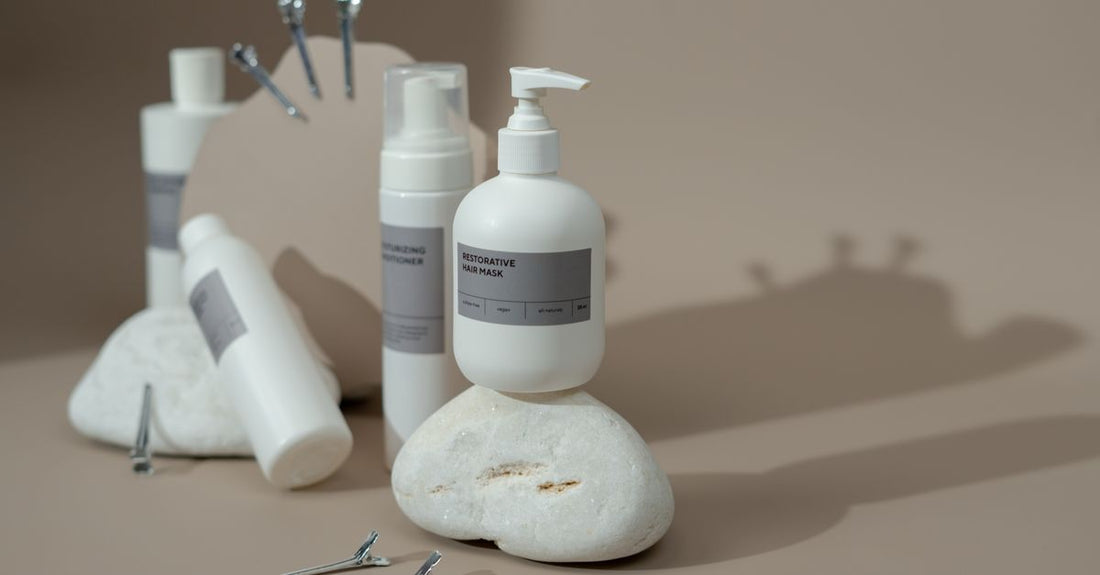 Matching shampoo and conditioner bottles on a bathroom shelf, illustrating a shampoo & conditioner sets buying guide UK