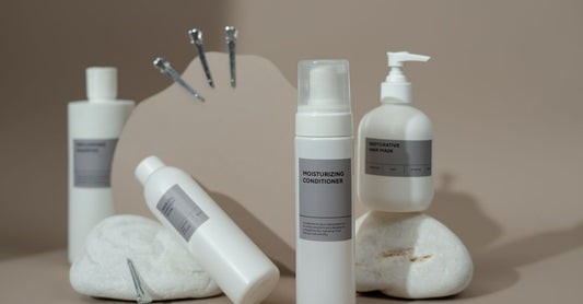 Two-in-one shampoo and conditioner bottles displayed on a clean bathroom shelf, illustrating a 2-in-1 shampoo & conditioner buying guide for UK shoppers.