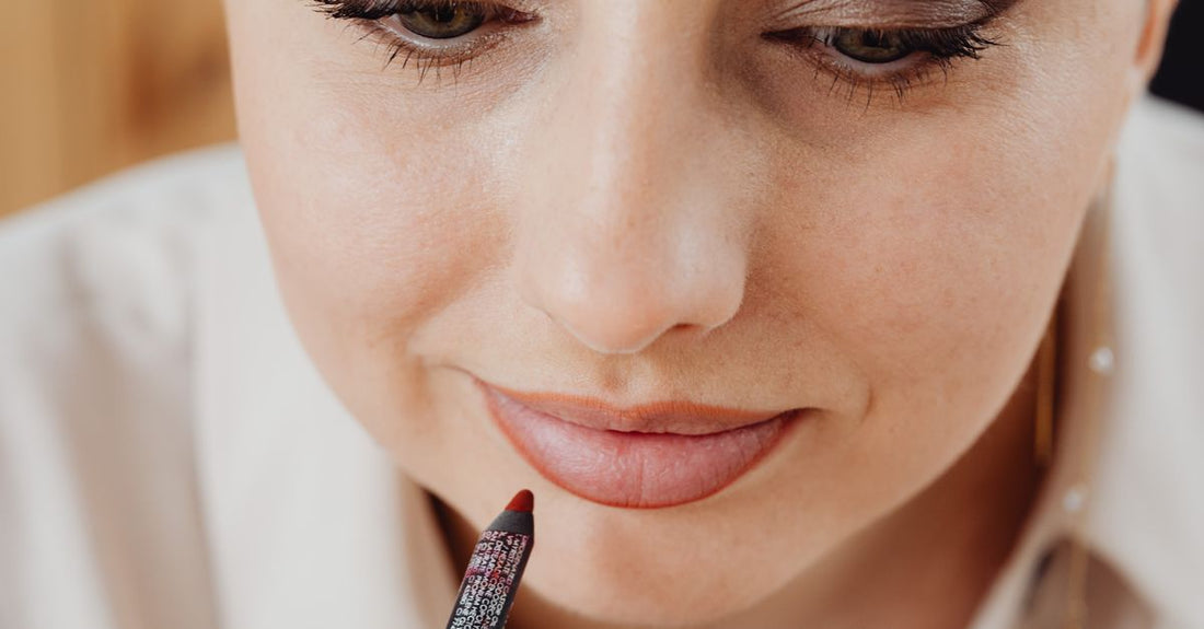 A selection of lip liner pencils in various nude and pink shades arranged on a white background, demonstrating how to choose lip liners.