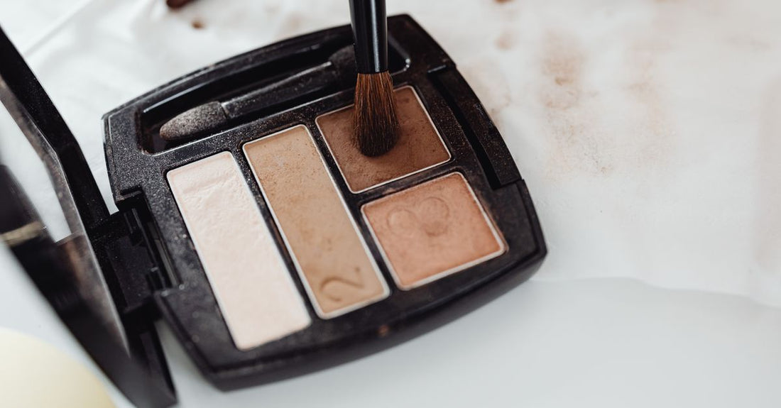 Neutral eyeshadow palette flatlay showing matte and shimmer shades in a sleek compact, eyeshadow buying guide UK