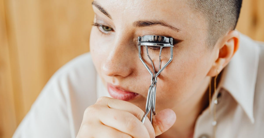 Stainless steel eyelash curler on a clean white background, the best eyelash curler for straight lashes.