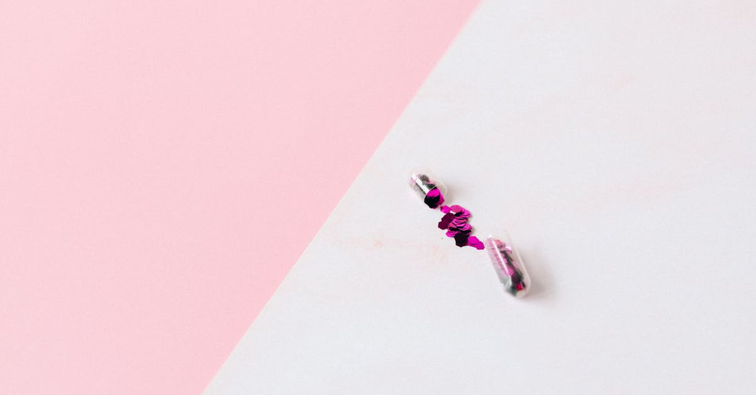 An array of body glitter products including sprays and gels with fine and chunky shimmer on a flat surface, how to choose body glitter guide.