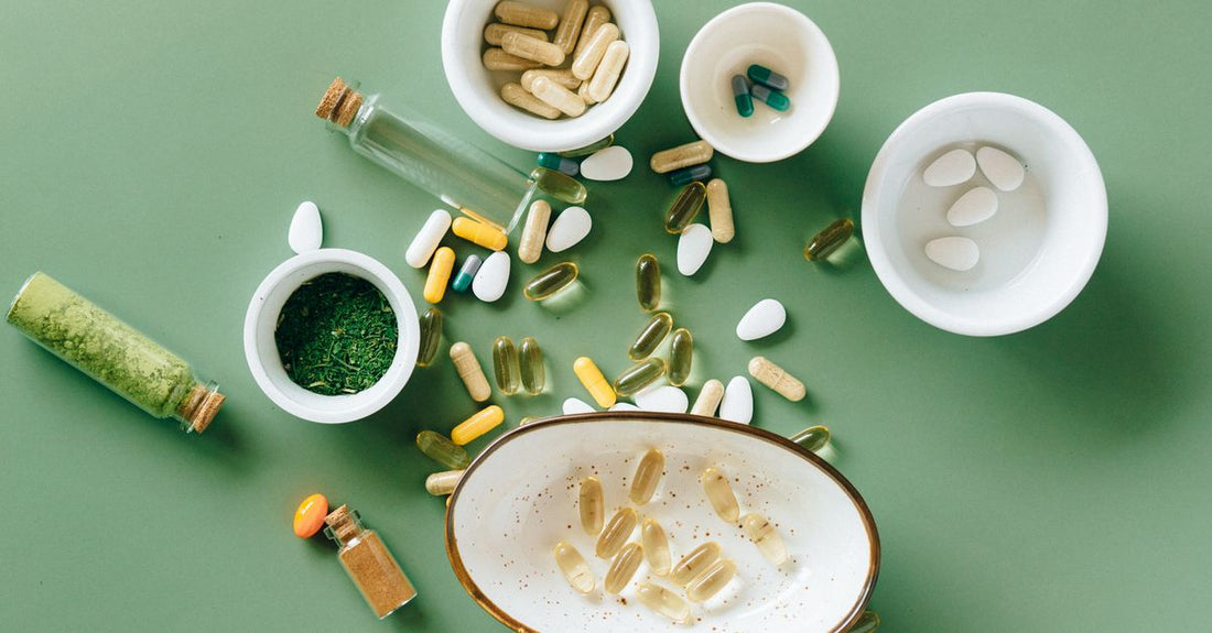 How to choose alternative medicine: a flatlay of herbal supplement bottles and natural wellness products on a light surface, illustrating a value-conscious UK shopper's daily routine.