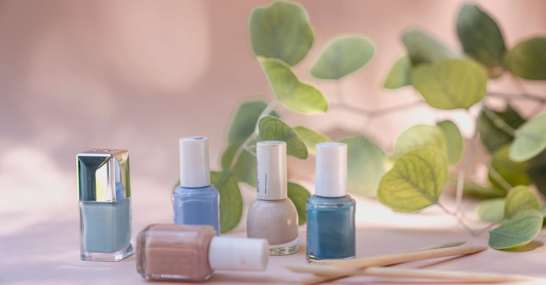 A selection of the best nail polish UK 2026 bottles on a white marble surface, showcasing vibrant, long-lasting gel colours.