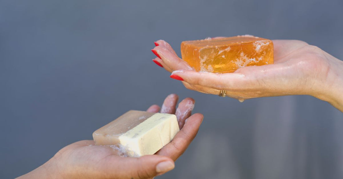 A collection of natural cleansing bars on a wooden tray, illustrating a bars buying guide.
