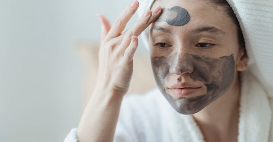 Assorted face masks buying guide flatlay showing sheet masks, clay masks and hydrogel masks on a clean white surface with skincare tools.