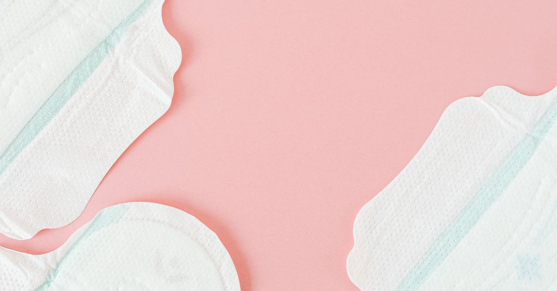 A stack of pure white cotton pads and rounds on a clean surface, illustrating how to choose cotton pads & rounds for skincare.