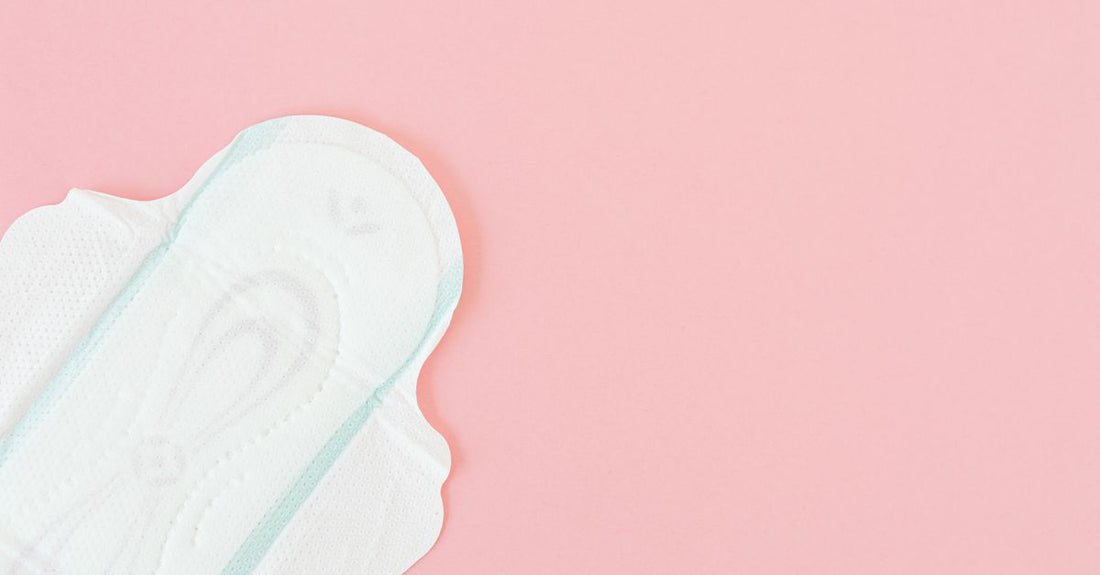 A flatlay of white cotton pads and balls on a clean surface, illustrating the cotton buying guide for UK skincare routines.