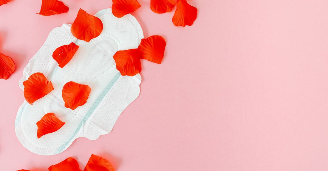 A selection of different cotton pads and reusable bamboo rounds arranged on a light marble surface, illustrating how to choose cotton pads & rounds for your skincare routine.