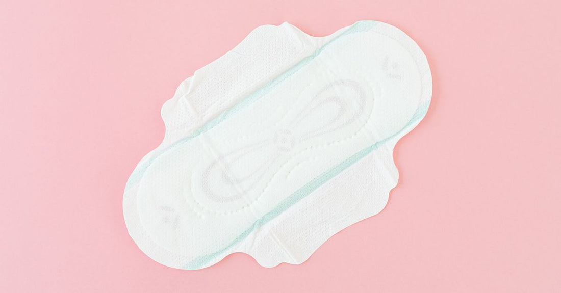 A stack of pure white cotton rounds on a marble surface, showcasing the best cotton pads & rounds 2026 for skincare.